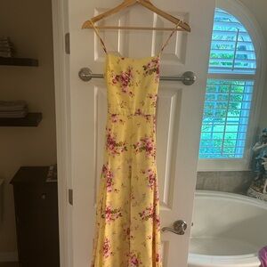 Likely Yellow Dress with Pink Floral Design